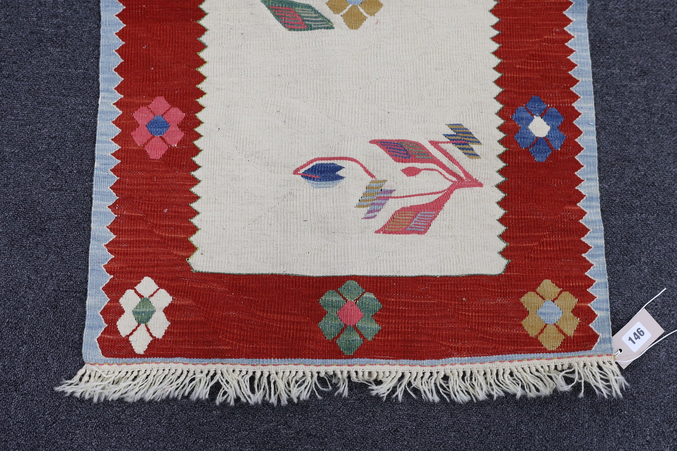 A Turkish floral mat, 100 x 60cm